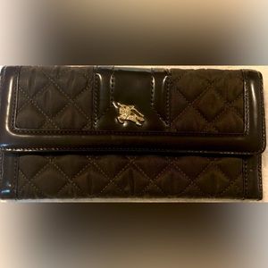 Burberry quilted wallet brown with gold trimming.